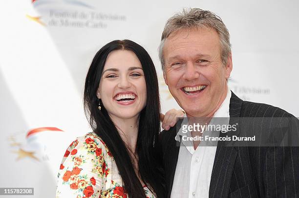 Anthony Head and Katie McGrath pose during a photocall for the TV show 'The Adventures Of Merlin' during the 2011 Monte Carlo Television Festival...