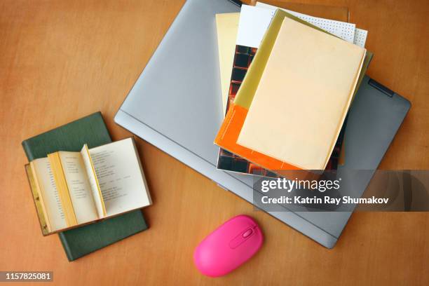 book atop laptop series (creative brief - digital wellbeing) - text book stockfoto's en -beelden