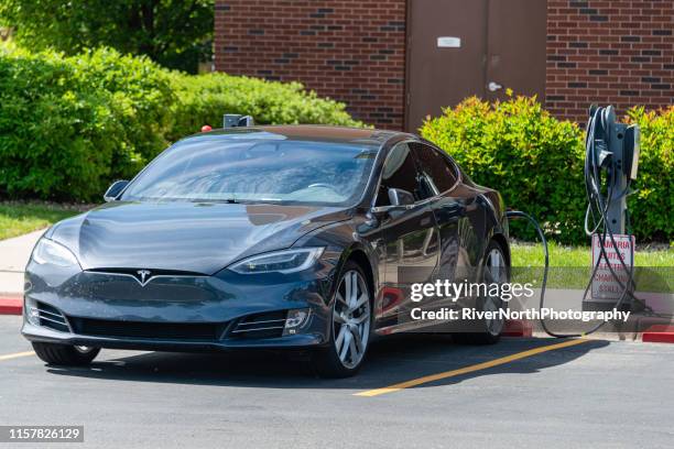 tesla charging station - tesla model s stock pictures, royalty-free photos & images