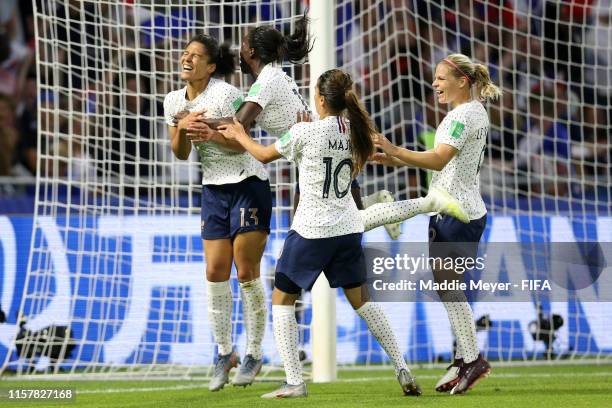 Valerie Gauvin of France celebrates with teammates after scoring her team's first goal during the 2019 FIFA Women's World Cup France Round Of 16...