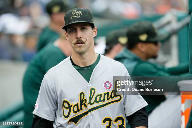 Starting pitcher Daniel Mengden of the Oakland Athletics walks through the dugout during a game against the Detroit Tigers at Comerica Park on May...