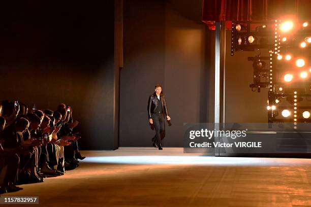 Fashion designer Hedi Slimane walks the runway during the Celine Menswear Spring Summer 2020 fashion show as part of Paris Fashion Week on June 23,...