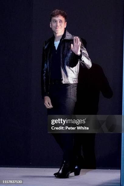 Hedi Slimane acknowledges the applause of the public after the Celine Menswear Spring Summer 2020 show as part of Paris Fashion Week on June 23, 2019...