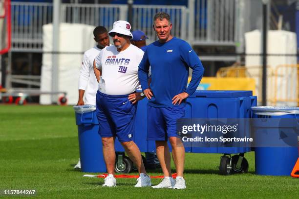 New York Giants general manager Dave Gettleman talks with New York Giants head coach Pat Shurmur during training camp on July 26 2019 at Quest...