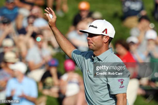 Chez Reavie of the United States celebrates on the 18th green after making a par to win the Travelers Championship at TPC River Highlands on June 23,...