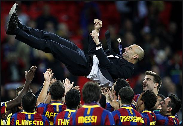 Josep Guardiola manager of Barcelona is thrown in the air as Barcelona celebrate winning the UEFA Champions League final between FC Barcelona and...
