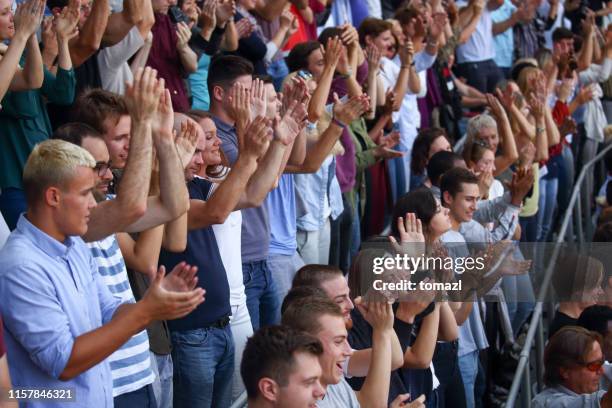 spectators clapping on a stadium - crowd applauding stock pictures, royalty-free photos & images