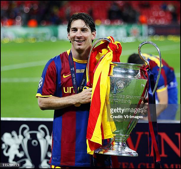 Lionel Messi with the trophy after the UEFA Champions League final between FC Barcelona and Manchester United FC at Wembley Stadium on May 28, 2011...