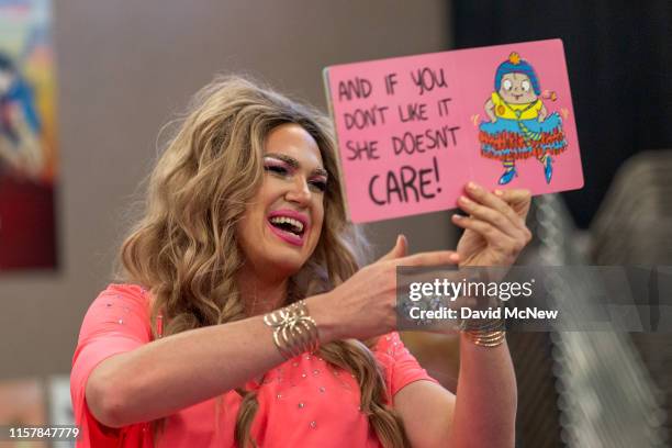 Drag queen "Pickle" reads from a book during the Drag Queen Story Hour program at the West Valley Regional Branch Library on July 26, 2019 in Los...