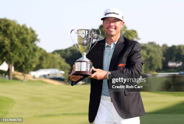 Chez Reavie of the United States poses with the trophy after winning the Travelers Championship at TPC River Highlands on June 23, 2019 in Cromwell,...