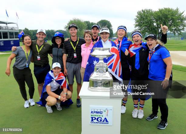 Hannah Green of Australia poses with the trophy with Karrie Webb , her caddie Nate Blasko and a number of other Australian friends and supporters...