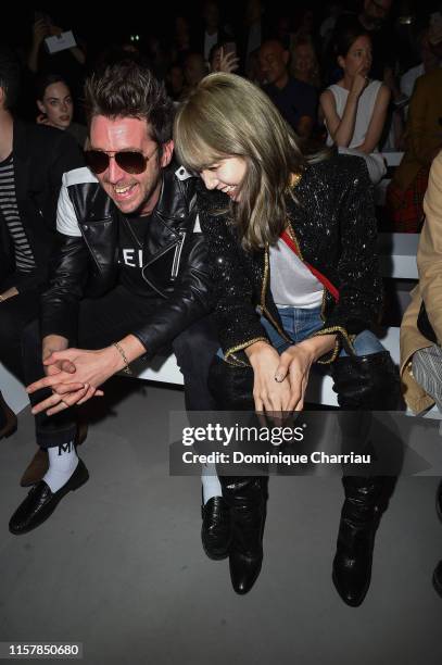 Miles Kane and singer Lisa attend the Celine Spring Summer 2020 show as part of Paris Fashion Week on June 23, 2019 in Paris, France.