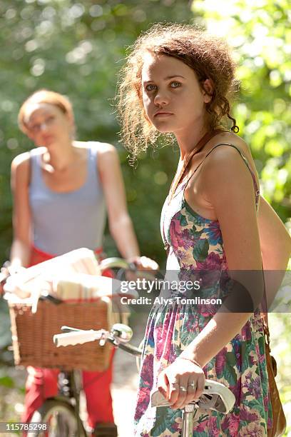 portrait of teenage girl with bike - floral pattern dress stock pictures, royalty-free photos & images