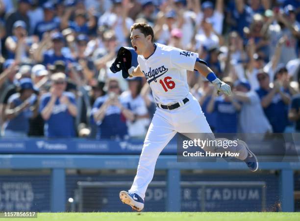 Will Smith of the Los Angeles Dodgers celebrates his walk-off two run homerun, for a 5-3 win over the Colorado Rockies, during the ninth inning at...