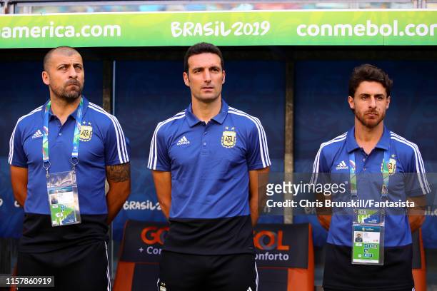 Argentina coach Lionel Scaloni looks on next to his assistants Walter Samuel and Pablo Aimar during the Copa America Brazil 2019 group B match...