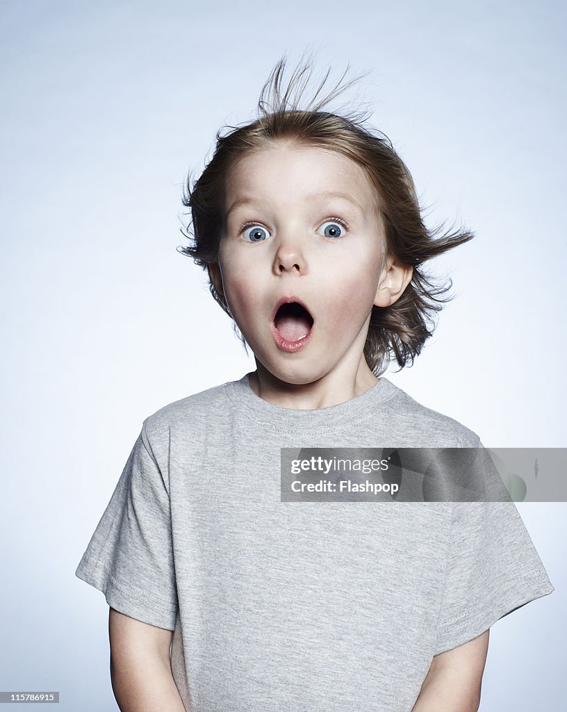 Portrait of boy looking surprised