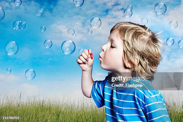 boy blowing bubbles - bubble wand stock pictures, royalty-free photos & images