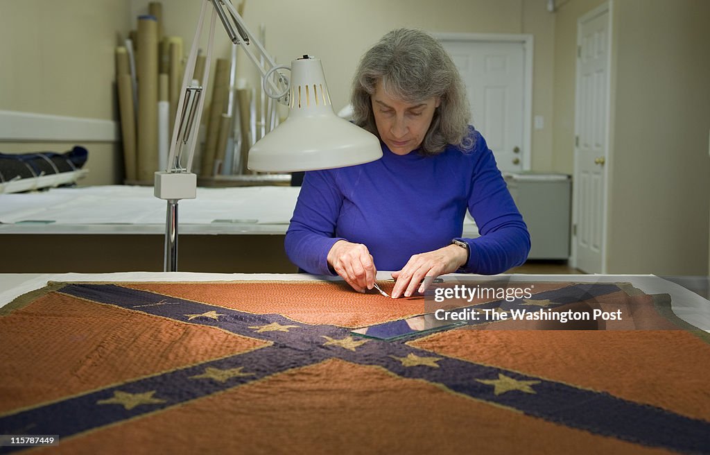 Cathy L. Heffner works to restore Civil War era flags at Textile Preservation Associates