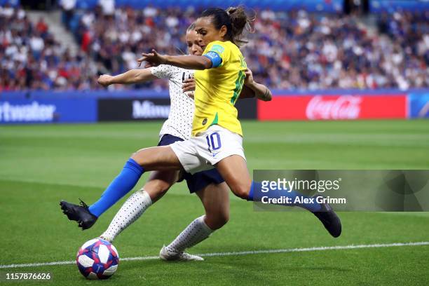 Marta of Brazil is challenged by Marion Torrent of France during the 2019 FIFA Women's World Cup France Round Of 16 match between France and Brazil...