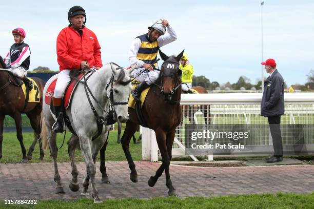 Damien Oliver returns to the mounting yard on Benitoite after winning the Jenna Ross VOBIS Gold Reef , at Caulfield Racecourse on July 27, 2019 in...