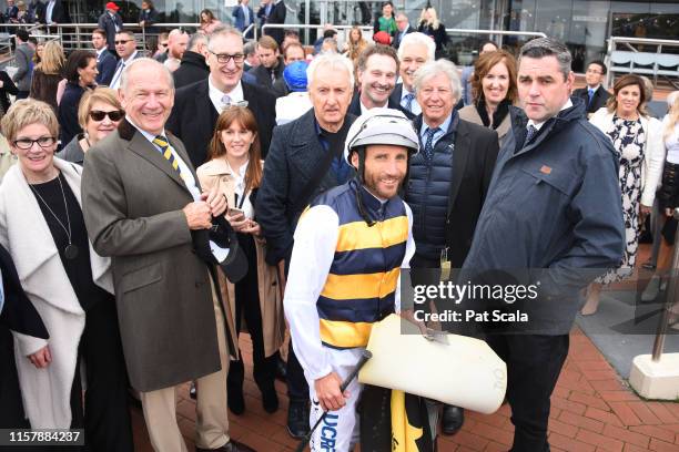 Damien Oliver with the connections of Benitoite after winning the Jenna Ross VOBIS Gold Reef , at Caulfield Racecourse on July 27, 2019 in Caulfield,...