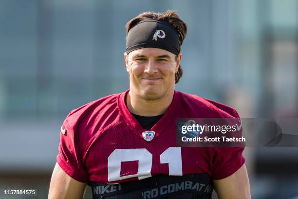 Ryan Kerrigan of the Washington Redskins walks to the field during training camp at Bon Secours Washington Redskins Training Center on July 26, 2019...