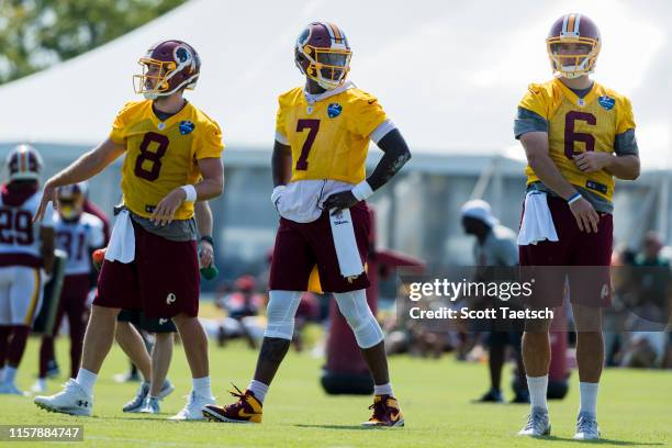 Case Keenum of the Washington Redskins participates in drills along with Dwayne Haskins and Josh Woodrum during training camp at Bon Secours...