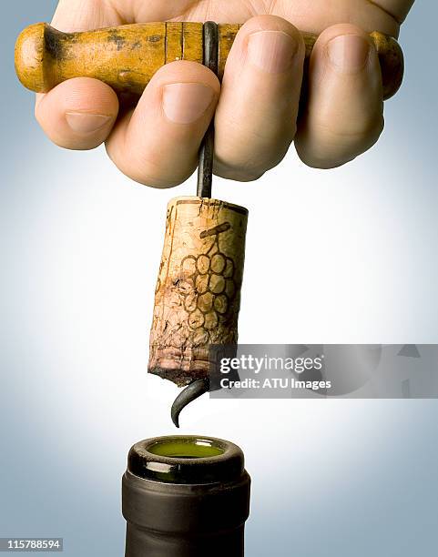 corkscrew pulled from bottle - kurk drankenbenodigdheden stockfoto's en -beelden