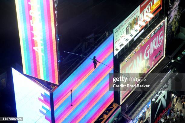 Lijana Wallenda walks a high wire over Times Square during the Highwire Live In Times Square With Nik Wallenda on June 23, 2019 in New York City.