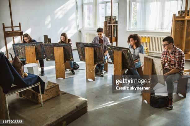 group of students drawing their paintings on a class at art studio. - modelo vivo imagens e fotografias de stock