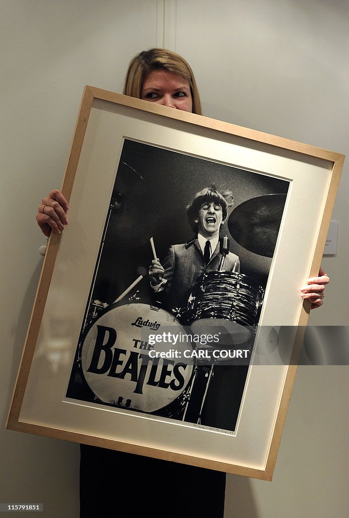 A Christie's auction house employee hold