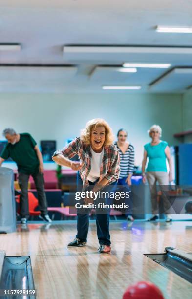 senior friends bowling - senior men bowling stock pictures, royalty-free photos & images