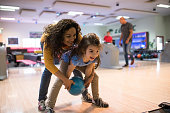 Mother and daughter bowling