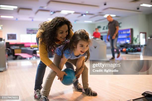 mother and daughter bowling - bowling stock pictures, royalty-free photos & images