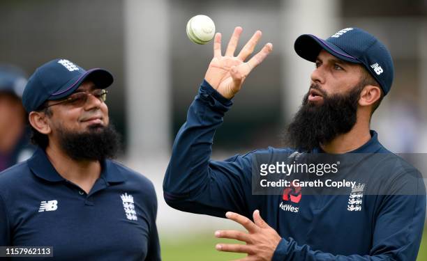 Moeen Ali of England speaks with coach Saqlain Mushtaq during a nets session at Lords on June 24, 2019 in London, England.