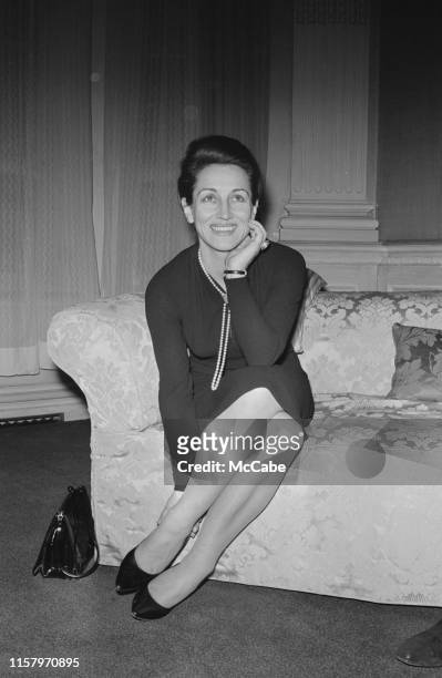 French painter, critic, and bestselling author Francoise Gilot sitting on a couch, UK, 3rd March 1965.