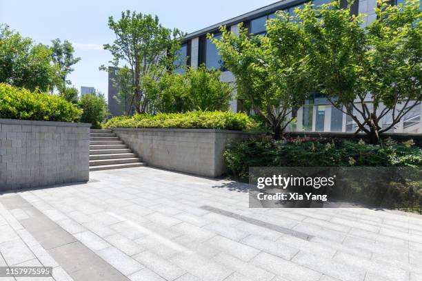 empty parking lot - landscaped walkway stock pictures, royalty-free photos & images