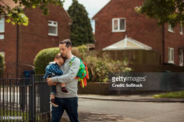 father and son enjoying a relaxing walk - baby father hug side stock pictures, royalty-free photos & images