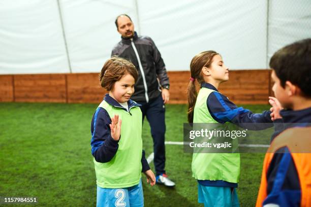 kids soccer training - cochlea implant stock pictures, royalty-free photos & images