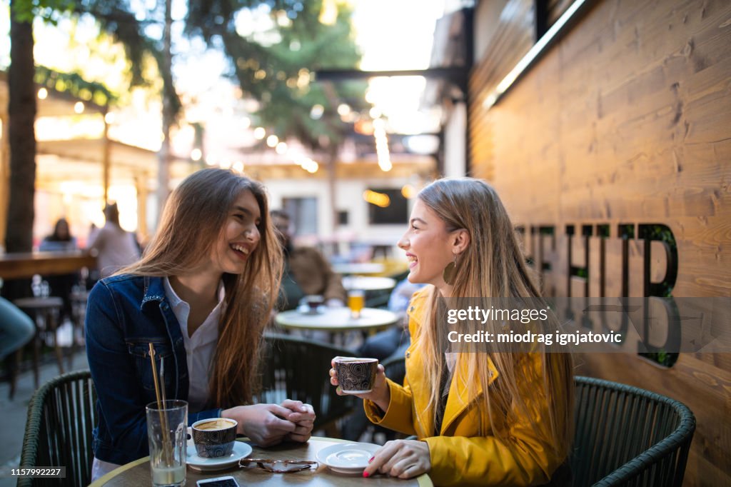 Gossip time for female friends in cafe