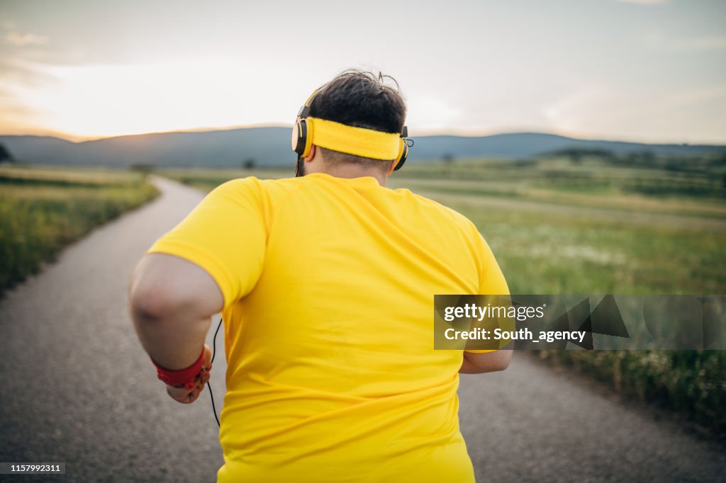 Overweight man jogging