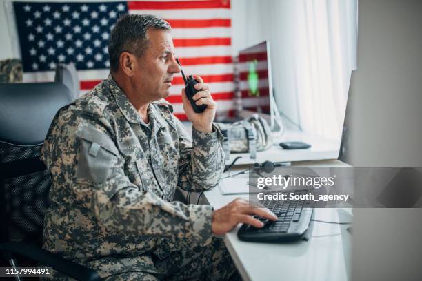 army soldier using walkie- talkie - military communications stock pictures, royalty-free photos & images