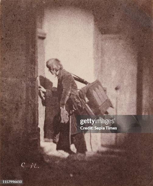 [Organ Grinder at 21. Quai Bourbon. Ile Saint-Louis. Paris]; Charles Negre. French. 1820 - 1880; Paris. France. Europe; before March or May 1853;...