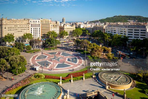 sunny day in plaça de catalunya, barcelona, spain - catalonia stock pictures, royalty-free photos & images