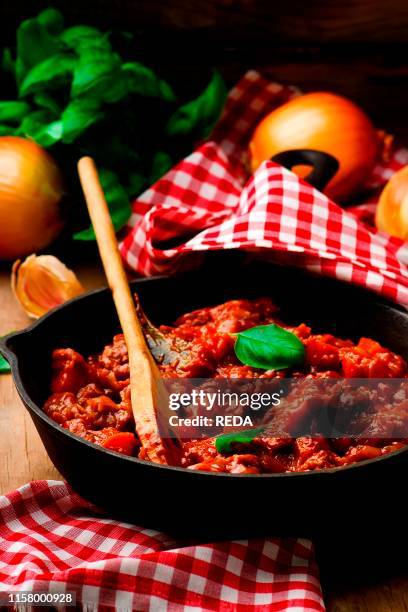 Ragout with meat and vegetables in a frying pan. Style rustic . Selectve focus.