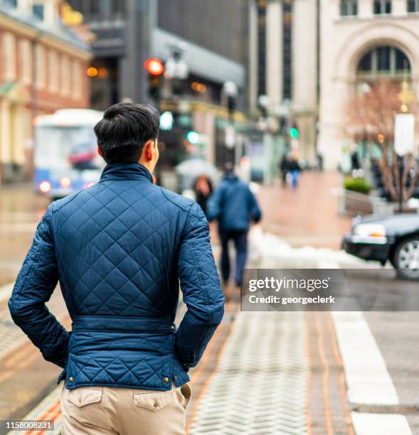 crossing the street in boston - pedestrian winter stock pictures, royalty-free photos & images