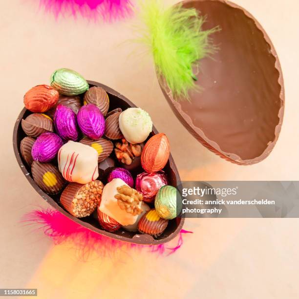 chocolates in easter egg - filling stock pictures, royalty-free photos & images