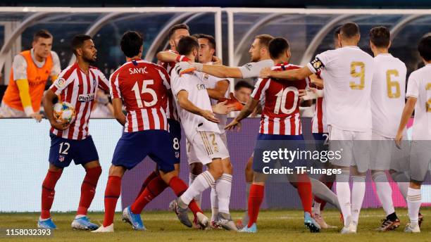 Daniel Cavajal of Real Madrid, Stefan Savic of Atletico de Madrid, Saul Niguez of Atletico de Madrid and Renan Lod of Atletico de Madrid gesture...