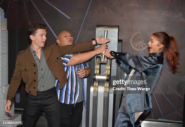 Tom Holland, Jacob Batalon and Zendaya attend as Stars Of "Spider-Man: Far From Home" Light The Empire State Building at The Empire State Building on...