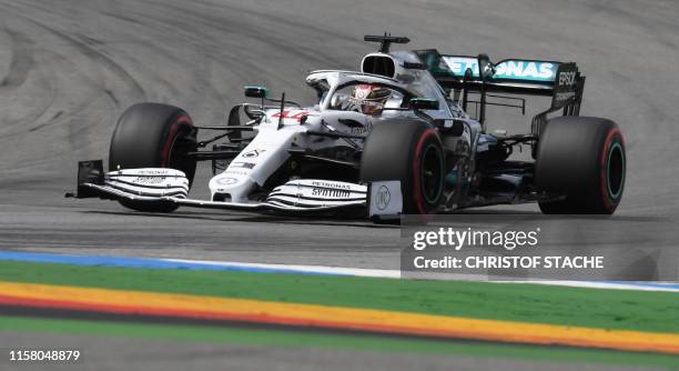 Mercedes AMG's British driver Lewis Hamilton steers his car during the qualifying session of the German Formula One Grand Prix at the Hockenheim...